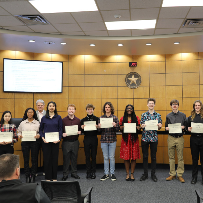 Students accepting recognition with Board of Trustees